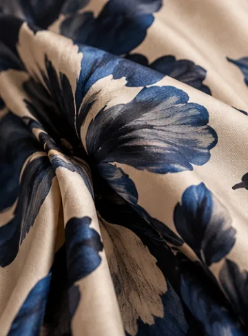 Blue floral print on softly folded ivory fabric