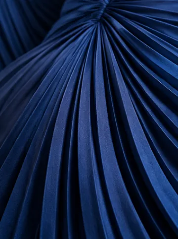 Cobalt blue chiffon gathered into fine flowing pleats